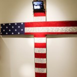 This installation included a cross hung in the american flag was inscribed with racial slurs